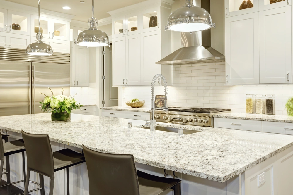 Luxurious kitchen remodel in Incline Village featuring a spacious island with granite countertops and pendant lighting.